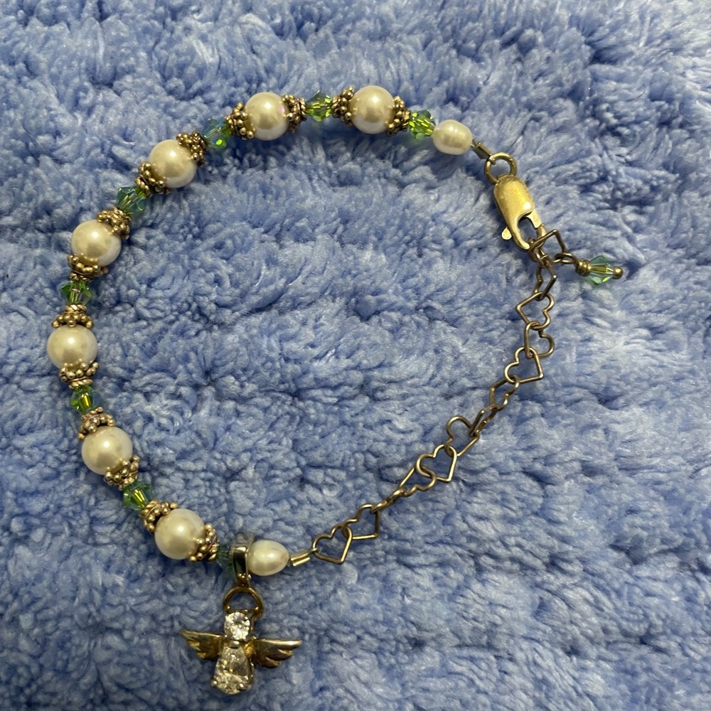 Children’s size silver,pearl, and peridot bracelet first communion